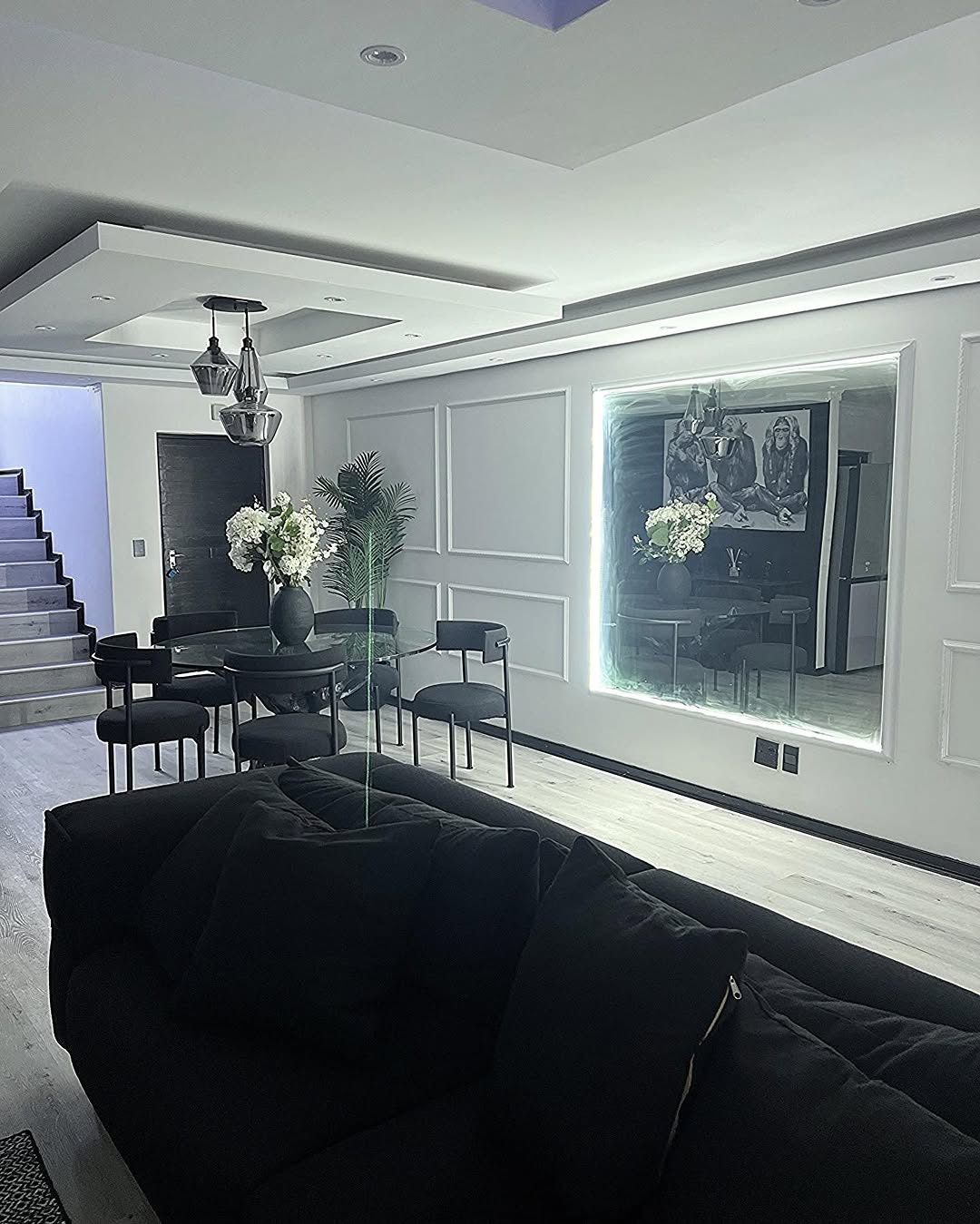 Monochrome living — Wall panelling, statement art and glass